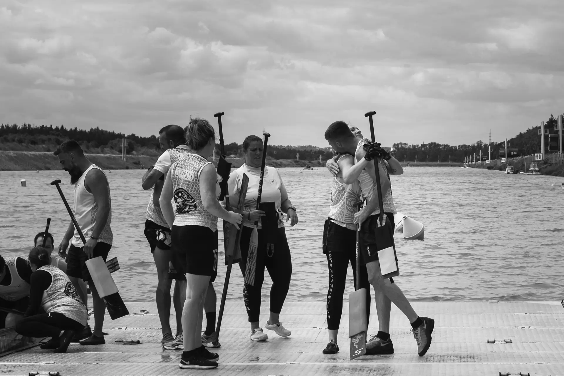 dragon boat cyprus national team hug after dragon boat race