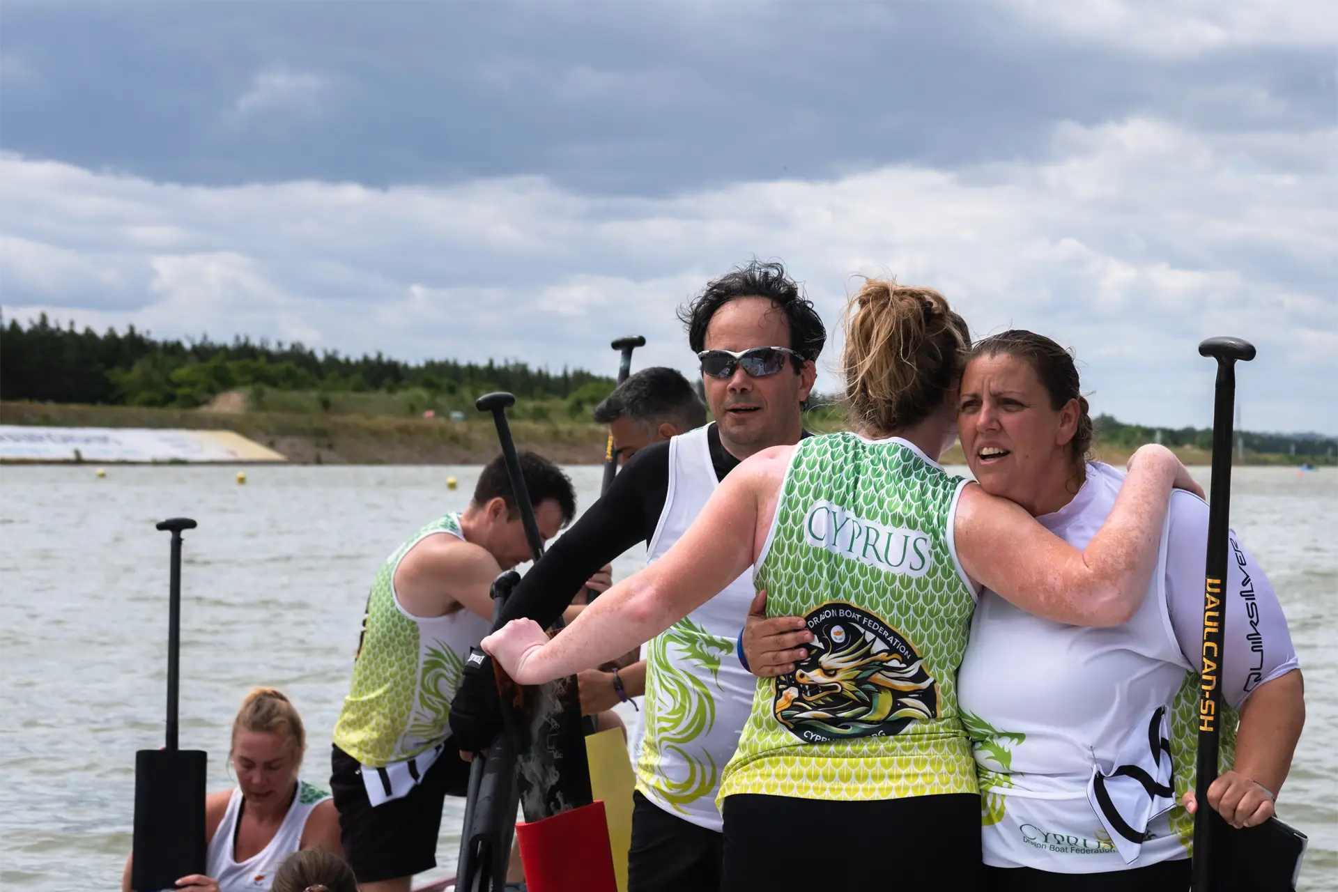 dragon boat cyprus national team hug after dragon boat race