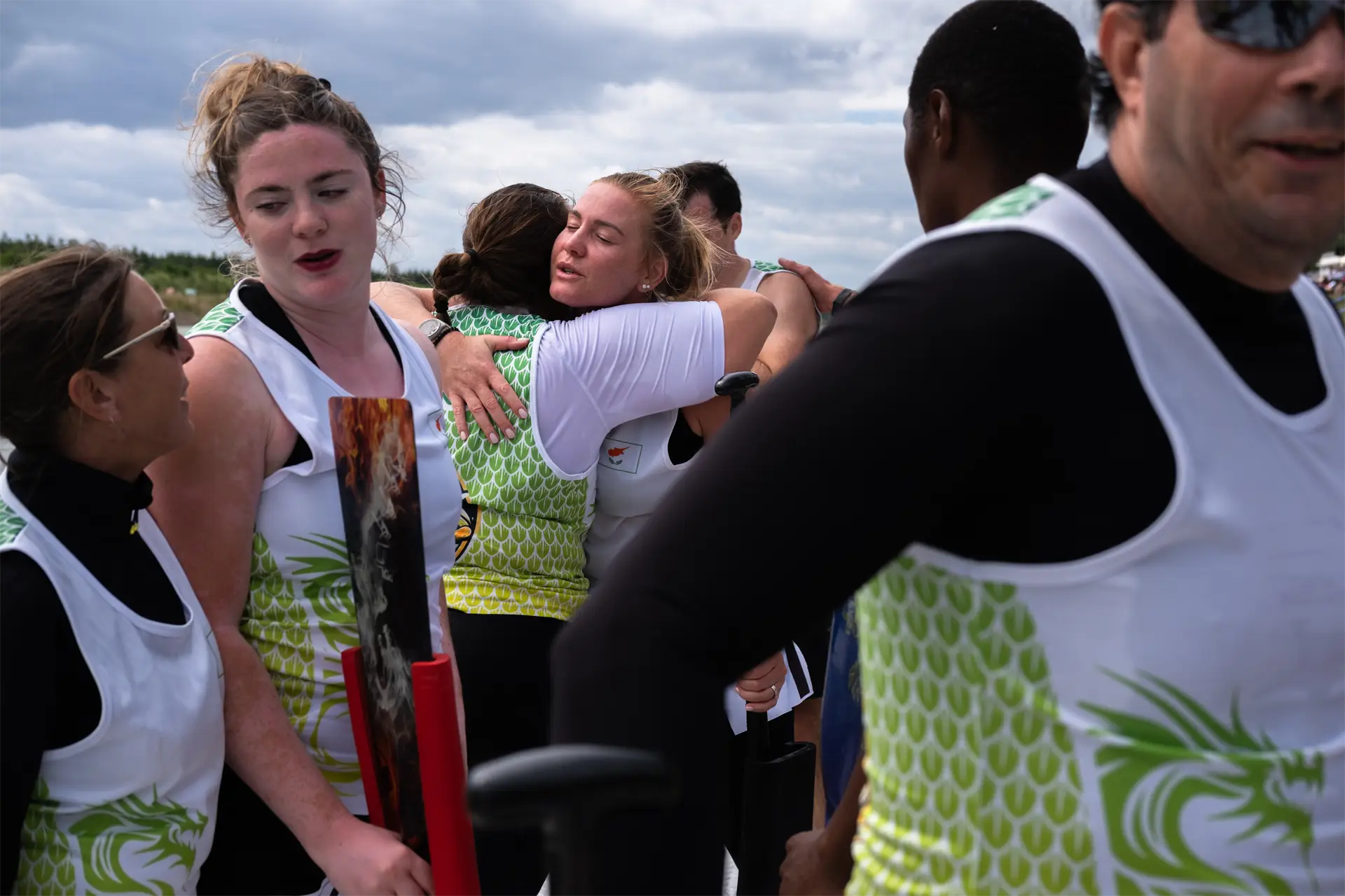 dragon boat cyprus national team hug after dragon boat race