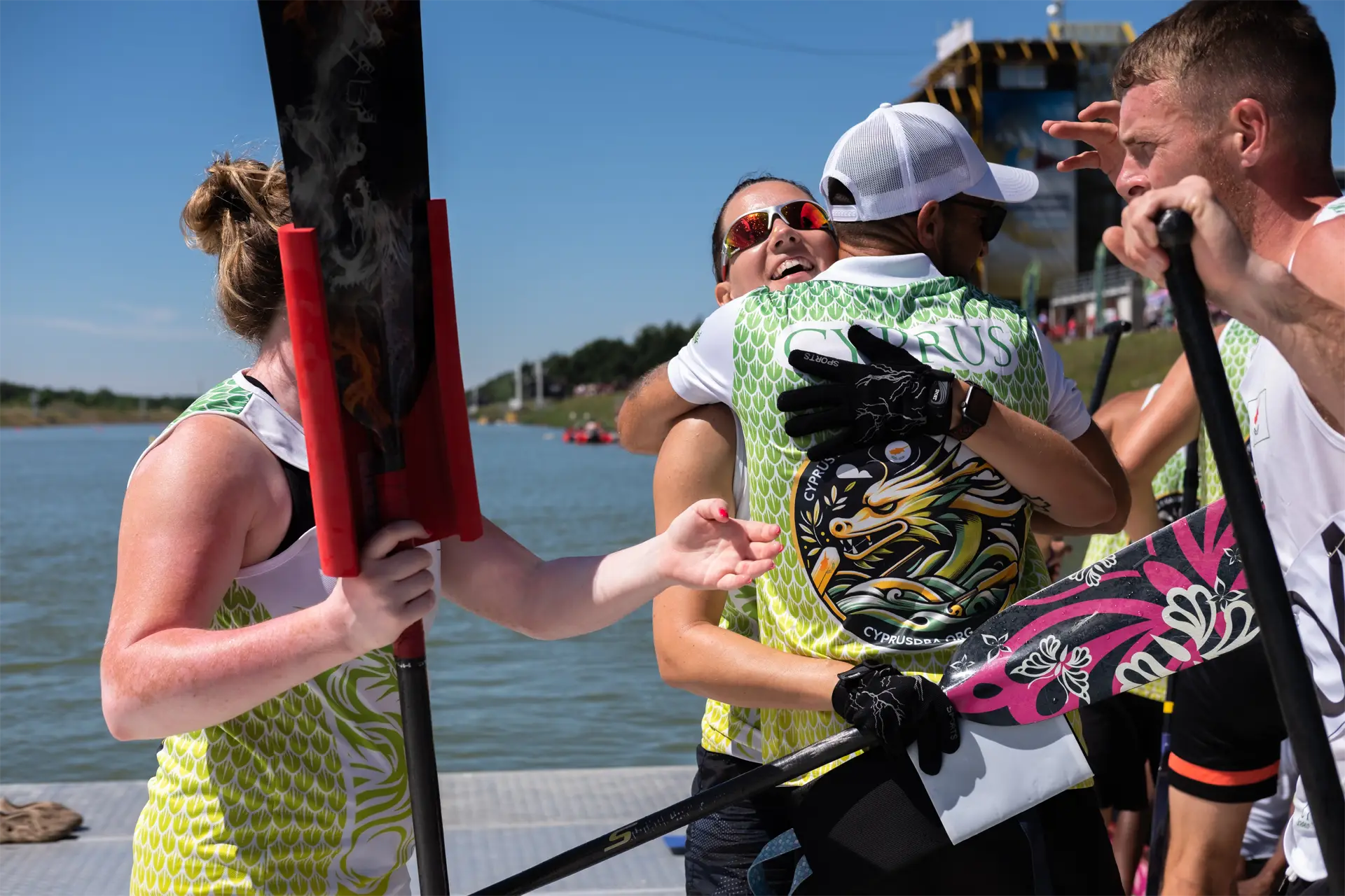 dragon boat cyprus national team hugging after dragon boat race