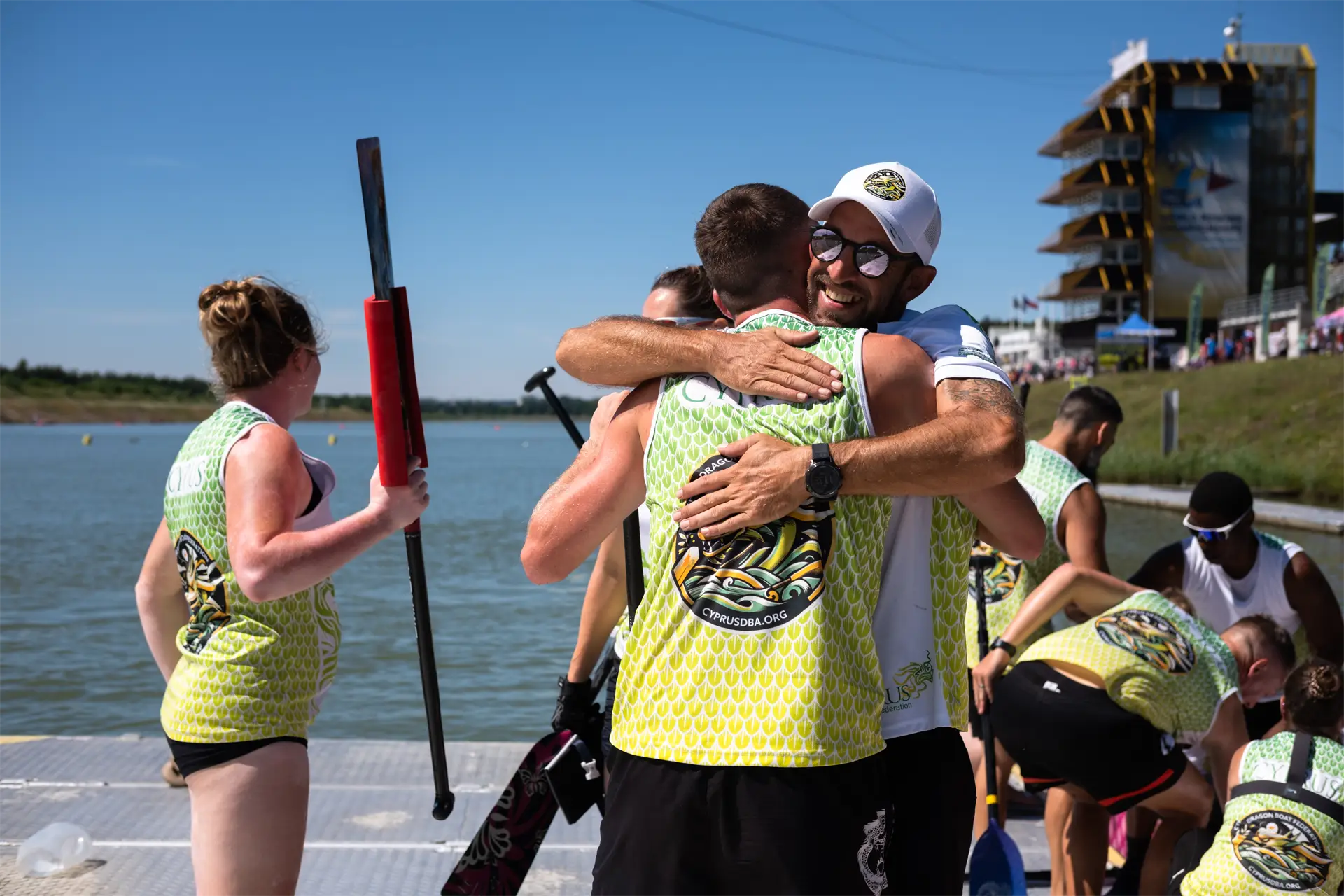 dragon boat cyprus national team hugging after dragon boat race